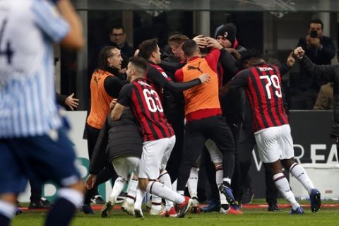 AC Milan players celebrate after scoring their second goal during a Serie A soccer match between AC Milan and Spal, at the San Siro stadium, Saturday, Dec. 29, 2018. (AP Photo/Antonio Calanni)