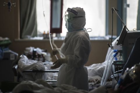 In this Saturday, Feb. 22, 2020, photo released by Xinhua News Agency, a nurse works at an ICU ward specialised for patients infected by coronavirus in Wuhan in central China's Hubei Province. Warning that China's virus epidemic is "still grim and complex," President Xi Jinping called Sunday, Feb. 23, 2020 for more efforts to stop the outbreak, revive industry and prevent the disease from disrupting spring planting of crops. (Xiao Yijiu/Xinhua via AP)