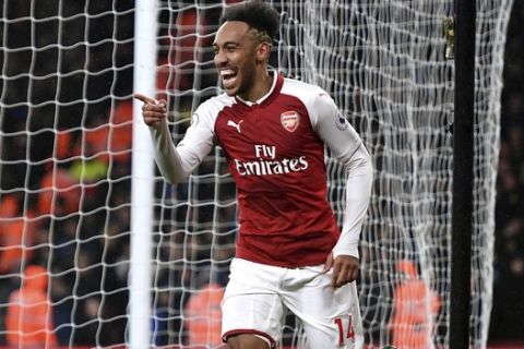 Arsenals's Pierre-Emerick Aubameyang celebrates after scoring his side's fourth goal of the game during their English Premier League soccer match against Everton at the Emirates Stadium, London, Saturday, Feb. 3, 2018. (Victoria Jones/PA via AP)