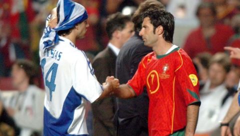 epa000226753 Portuguese player, Luis Figo (R) congratulates greek player Fyssas (L) after Greece won the Euro 2004 final between Portugal and Greece at Luz stadium in Lisbon on Sunday, 04 July 2004.  EPA/MANUEL DE ALMEIDA NO MOBILE PHONE APPLICATIONS