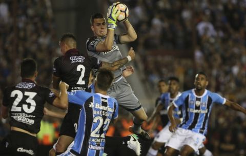 Gremio's goalkeeper, Marcelo Grohe, of Brazil, secures the ball during the final Copa Libertadores championship soccer match against Argentina's Lanus in Buenos Aires, Argentina, Wednesday, Nov. 29, 2017. (AP Photo/Esteban Felix)