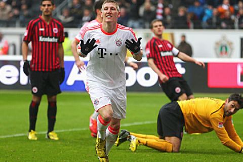 FRANKFURT AM MAIN, GERMANY - APRIL 06:  Bastian Schweinsteiger of FC Bayern Muenchen celebrates scoring the opening goal during the Bundesliga match between Eintracht Frankfurt and FC Bayern Muenchen at the Commerzbank-Arena on April 6, 2013 in Frankfurt am Main, Germany.  (Photo by Alex Grimm/Bongarts/Getty Images)