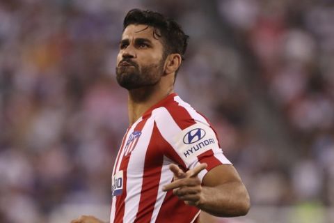 Atletico Madrid forward Diego Costa celebrates after scoring a goal during the first half of an International Champions Cup soccer match against Real Madrid, Friday, July 26, 2019, in East Rutherford, N.J. Atletico Madrid won 7-3. (AP Photo/Steve Luciano)