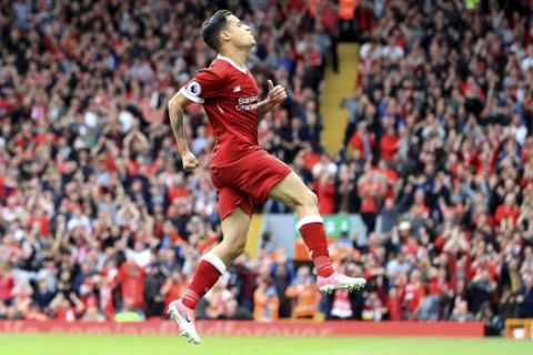 Liverpool's Philippe Coutinho celebrates scoring against Middlesbrough during the English Premier League soccer match at Anfield, Liverpool, England, Sunday May 21, 2017. (Peter Byrne/PA via AP)