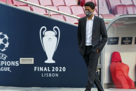 PSG president Nasser Al-Khelaifi stands by the bench during a training session at the Luz stadium in Lisbon, Saturday Aug. 22, 2020. PSG will play Bayern Munich in the Champions League final soccer match on Sunday. (Miguel A. Lopes/Pool via AP)