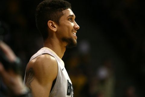 Colorado junior guard Askia Booker (0) smiles after making the bucket and getting fouled during an NCAA men's basketball game between the No. 20 Colorado Buffaloes and the No. 10 Oregon Ducks, Sunday, Jan. 5, 2014, at the Coors Events Center in Boulder, Colo. The Buffs won 100-91. (Kai Casey/CU Independent)