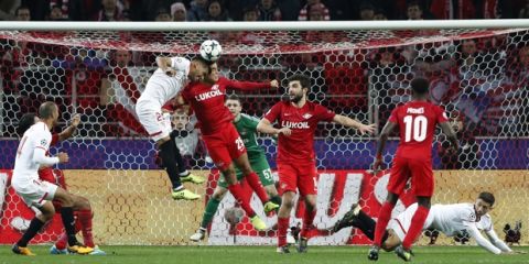 Sevilla's Gabriel Mercado, left, heads the ball with Spartak's Lorenzo Melgarejo during the Champions League group E soccer match between Spartak Moscow and Sevilla at the Otkrytiye Arena in Moscow, Russia, Tuesday, Oct. 17,2017.(AP Photo/Pavel Govolkin)