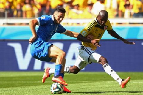 BELO HORIZONTE, BRAZIL - JUNE 14:  Konstantinos Manolas of Greece controls the ball against Victor Ibarbo of Colombia during the 2014 FIFA World Cup Brazil Group C match between Colombia and Greece at Estadio Mineirao on June 14, 2014 in Belo Horizonte, Brazil.  (Photo by Quinn Rooney/Getty Images)