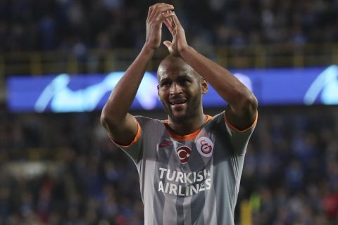 Galatasaray's Marcao applauds fans at the end of the Champions League group A soccer match between Club Brugge and Galatasaray at the Jan Breydel stadium in Bruges, Belgium, Wednesday, Sept. 18, 2019. (AP Photo/Francisco Seco)