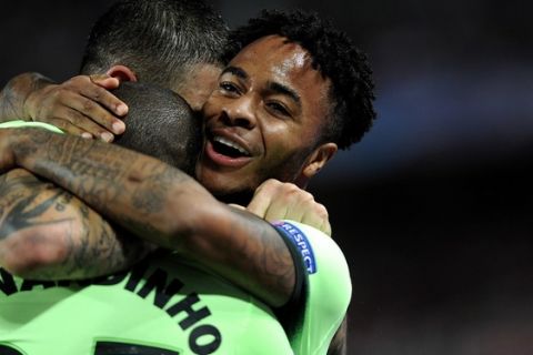 Manchester City's English midfielder Raheem Sterling (R) celebrates after scoring with teammates  after scoring during the UEFA Champions League football match Sevilla FC vs Manchester City at the Ramon Sanchez Pizjuan stadium in Sevilla on November 3, 2015.  AFP PHOTO / CRISTINA QUICLER        (Photo credit should read CRISTINA QUICLER/AFP/Getty Images)