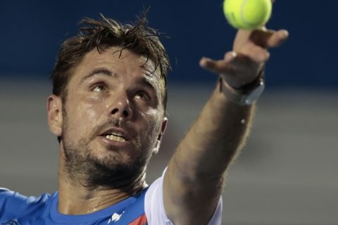 Switzerland's Stan Wawrinka serves during his first round match against Frances Tiafoe of the U.S., at the Mexican Tennis Open in Acapulco, Mexico, Monday, Feb. 24, 2020.(AP Photo/Rebecca Blackwell)