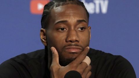 Toronto Raptors forward Kawhi Leonard speaks to reporters before a team practice in Oakland, Calif., Wednesday, June 12, 2019. The Raptors are scheduled to play the Golden State Warriors in Game 6 of basketball's NBA Finals on Thursday. (AP Photo/Jeff Chiu)