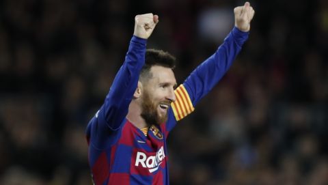 Barcelona's Lionel Messi celebrates after his team scored his side's fourth goal during a Spanish La Liga soccer match between Barcelona and Celta at Camp Nou stadium in Barcelona, Saturday, Nov. 9, 2019. (AP Photo/Joan Monfort)