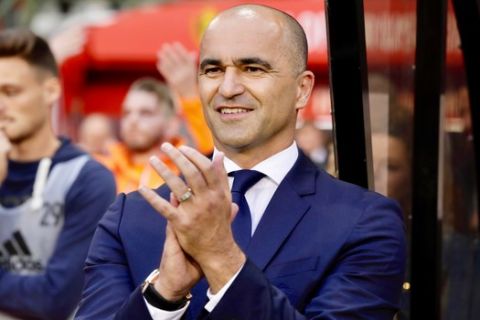 Belgium's coach Roberto Martinez applauds from the sidelines during a Euro 2020 group I qualifying soccer match between Belgium and Scotland at the King Baudouin Stadium in Brussels, Tuesday, June 11, 2019. (AP Photo/Olivier Matthys)