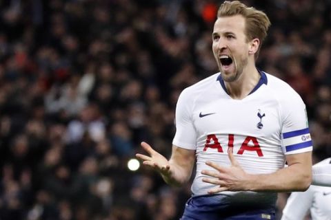 Tottenham's Harry Kane celebrates after scoring his side first goal during the English League Cup semifinal first leg soccer match between Tottenham Hotspur and Chelsea at Wembley Stadium in London, Tuesday, Jan. 8, 2019. (AP Photo/Frank Augstein)
