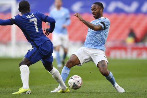 Manchester City's Raheem Sterling, right, challenges for the ball with Chelsea's N'Golo Kante during the English FA Cup semifinal soccer match between Chelsea and Manchester City at Wembley Stadium in London, England, Saturday, April 17, 2021. (Ben Stansall, Pool via AP)