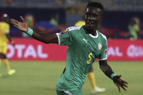 Senegal's Idrissa Gana Gueye celebrates after scoring his side's opening goal during the African Cup of Nations quarterfinal soccer match between Senegal and Benin in 30 June stadium in Cairo, Egypt, Wednesday, July 10, 2019. (AP Photo/Hassan Ammar)