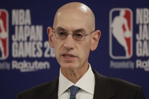 NBA Commissioner Adam Silver speaks at a news conference before an NBA preseason basketball game between the Houston Rockets and the Toronto Raptors Tuesday, Oct. 8, 2019, in Saitama, near Tokyo. (AP Photo/Jae C. Hong)