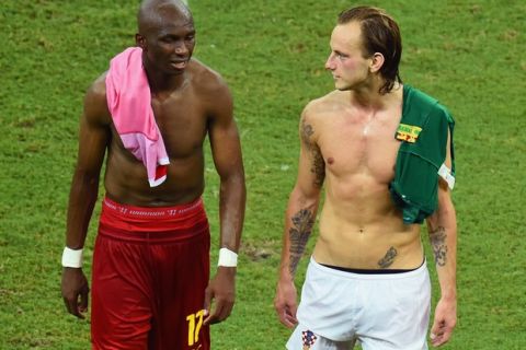 MANAUS, BRAZIL - JUNE 18: Stephane Mbia of Cameroon and Ivan Rakitic of Croatia walk off the field after Croatia's 4-0 win during the 2014 FIFA World Cup Brazil Group A match between Cameroon and Croatia at Arena Amazonia on June 18, 2014 in Manaus, Brazil.  (Photo by Stu Forster/Getty Images)