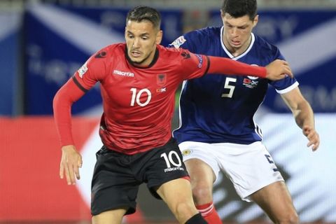 Scotland's Scott McKenna, right, and Albania's Rei Manaj fight for the ball during the UEFA Nations League soccer match between Albania and Scotland at Loro Borici stadium, in Shkoder, northern Albania, Saturday, Nov. 17, 2018. (AP Photo/Hektor Pustina)