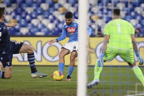 Lorenzo Insigne of Napoli, centre, scores the first goal of the game against Lazio, during their Italian Cup Serie A quarterfinal soccer match at San Paolo stadium in Napoli, Italy, Tuesday Jan. 21, 2020. (LaPresse via AP)