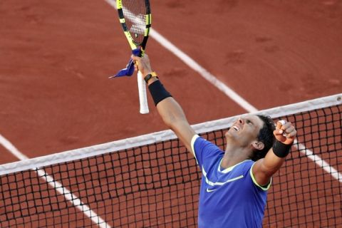 Spain's Rafael Nadal celebrates winning against Austria's Dominic Thiem during their semifinal match of the French Open tennis tournament at the Roland Garros stadium, in Paris, France, Friday, June 9, 2017. (AP Photo/Christophe Ena)