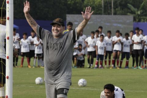 Diego Maradona, gestures as he attends a football clinic and workshop for young aspiring soccer players in Kadambagachhi, about 45 kilometers (28 miles) north of Kolkata, India, Tuesday, Dec. 12, 2017. The 1986 World Cup-winning captain for Argentina is on a three day visit to Kolkata. (AP Photo/Bikas Das)