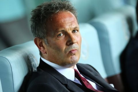 AC Milan coach Sinisa Mihajlovic sits on the bench during the Serie A soccer match between Udinese and AC Milan at the Friuli Stadium in Udine, Italy, Tuesday, Sept. 22, 2015. (AP Photo/Paolo Giovannini)