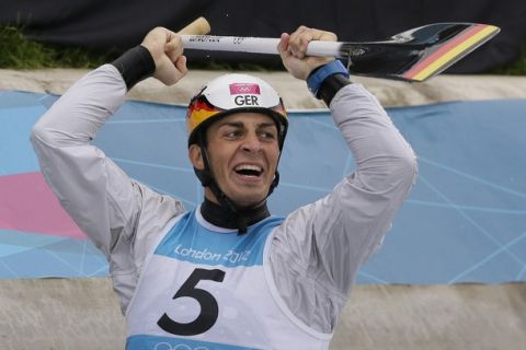 Sideris Tasiadis of Germany reacts after winning the silver medal in the final of the C-1 men's canoe slalom at Lee Valley Whitewater Center, at the 2012 Summer Olympics, Tuesday, July 31, 2012, in Waltham Cross near London. (AP Photo/Kirsty Wigglesworth)