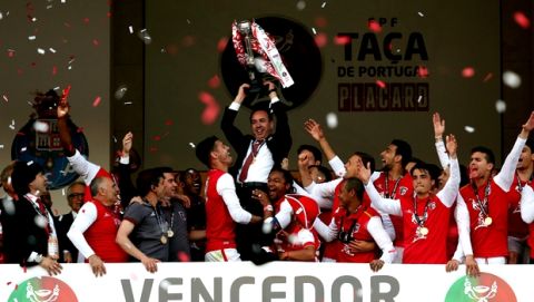 Braga players lift up the club president Antonio Salvador, after winning the Portugal Cup in the final soccer match against Porto with penalties Sunday, May 22, 2016, at the National stadium in Oeiras, outside Lisbon. Braga won the national soccer cup fifty years after their last time. (AP Photo/Steven Governo)