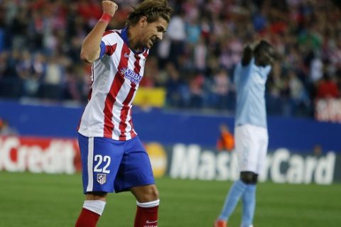 Atletico's Alessio Cerci celebrates after scoring during the Group A Champions League soccer match between Atletico de Madrid and Malmo at the Vicente Calderon stadium in Madrid, Spain, Wednesday, Oct. 22, 2014. (AP Photo/Andres Kudacki)