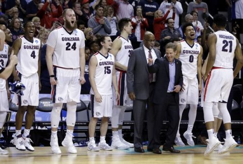 Gonzaga players and coaches celebrate in the closing minutes of a win over Xavier during the second half of an NCAA Tournament college basketball regional final game Saturday, March 25, 2017, in San Jose, Calif. (AP Photo/Ben Margot)