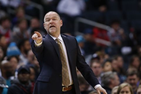Denver Nuggets head coach Michael Malone directs his team against the Charlotte Hornets during the second half of an NBA basketball game in Charlotte, N.C., Thursday, March 5, 2020. Denver won 114-112. (AP Photo/Nell Redmond)