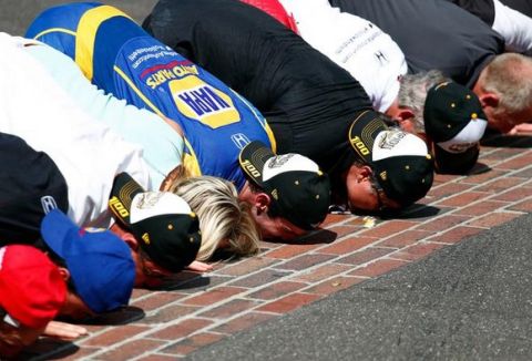 INDIANAPOLIS, IN - MAY 29:  Alexander Rossi of the United States, driver of the #98 Andretti Herta Autosport Honda Dallara, kisses the bricks after winning the 100th running of the Indianapolis 500 at Indianapolis Motorspeedway on May 29, 2016 in Indianapolis, Indiana.  (Photo by Jamie Squire/Getty Images)