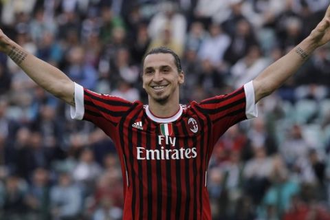 AC Milan Swedish forward Zlatan Ibrahimovic celebrates after scoring during a Serie A soccer match between Siena and Milan, in Siena, Italy, Sunday, April 29, 2012. (AP Photo/Paolo Lazzeroni)