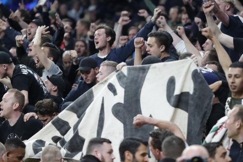 Tottenham fans cheer after the Champions League semifinal first leg soccer match between Tottenham Hotspur and Ajax at the Tottenham Hotspur stadium in London, Tuesday, April 30, 2019. Ajax won the match with a 1-0 score. (AP Photo/Frank Augstein)