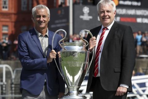 UEFA Ambassador and former Wales, Liverpool and Juventus soccer player Ian Rush and Welsh First Minister Carwyn Jones pose with the Champions League Trophy in Cardiff, Wales  Thursday June 1, 2017 ahead of the final between Juventus and Real Madrid on Saturday. (Nick Potts/PA via AP)