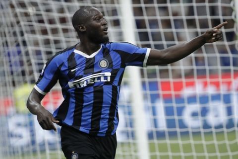 FILE - In this file photo taken on Aug. 26, 2019, Inter Milan's Romelu Lukaku celebrates after scoring his side's third goal during the Serie A soccer match between Inter Milan and Lecce at the San Siro stadium, in Milan, Italy. Lukaku left Manchester United for Inter Milan; of the 79 foreigners who joined Serie A in the recently concluded transfer window, 10 came from the English Premier League _ more than any other league. (AP Photo/Luca Bruno)