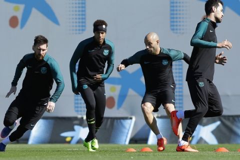 From left to right: FC Barcelona's Lionel Messi, Neymar, Javier Mascherano and Sergio Busquets attend a training session at the Sports Center FC Barcelona Joan Gamper in Sant Joan Despi, Spain, Tuesday, March 7, 2017. FC Barcelona will play against Paris Saint Germain in a Champions League round of 16, second leg, soccer match on Wednesday. (AP Photo/Manu Fernandez)