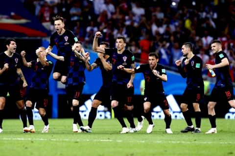 Croatia national soccer team players celebrate after winning the quarterfinal match between Russia and Croatia at the 2018 soccer World Cup in the Fisht Stadium, in Sochi, Russia, Saturday, July 7, 2018. (AP Photo/Manu Fernandez)