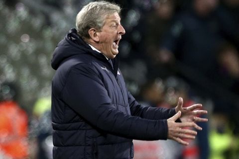 Crystal Palace manager Roy Hodgson gestures during the English Premier League soccer match between West Ham United and Crystal Palace at The London Stadium, London, Saturday, Dec. 8, 2018. (Yui Mok/PA via AP)