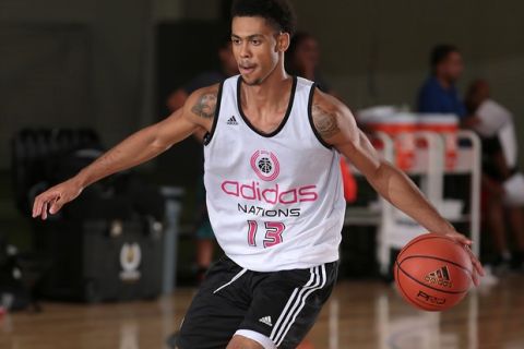 GARDEN GROVE, CA - AUG 2, 2014: Tyler Dorsey brings the ball up the court during the 2014 adidas Nations at Next Level Sports Complex in Garden Grove, California. (Photo by Kelly Kline/adidas) 
