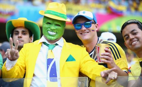 BELO HORIZONTE, BRAZIL - JUNE 14:  Fans enjoy the atmosphere in the stands during the 2014 FIFA World Cup Brazil Group C match between Colombia and Greece at Estadio Mineirao on June 14, 2014 in Belo Horizonte, Brazil.  (Photo by Paul Gilham/Getty Images)