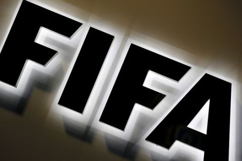 FILE - This Sept. 25, 2015 file photo shows the FIFA logo outside FIFA headquarters in Zurich, Switzerland. FIFA will hold talks with human rights groups about issues associated with expanding the 2022 World Cup in the Persian Gulf beyond host Qatar.  (AP Photo/Michael Probst, file)