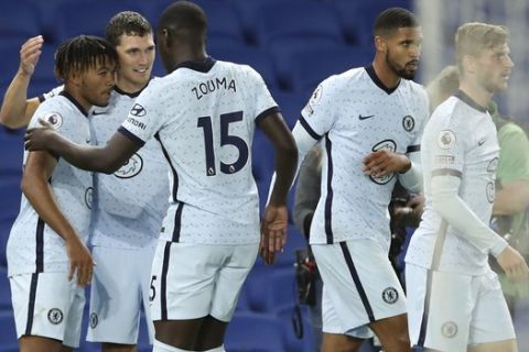 Chelsea's Reece James, left, is congratulated by teammates after scoring his team's second goal during the English Premier League soccer match between Brighton and Chelsea at Falmer Stadium in Brighton, England, Monday, Sept. 14, 2020. (Peter Cziborra/Pool via AP)