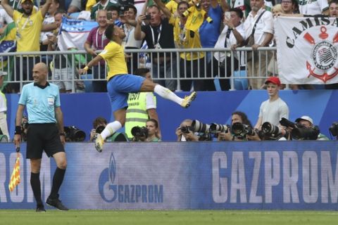 Brazil's Neymar celebrates after scoring the opening goal during the round of 16 match between Brazil and Mexico at the 2018 soccer World Cup in the Samara Arena, in Samara, Russia, Monday, July 2, 2018. (AP Photo/Thanassis Stavrakis)