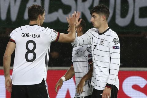 Germany's Timo Werner, right, reacts after scoring the opening goal of his team during the World Cup 2022 group J qualifying soccer match between North Macedonia and Germany at National Arena Todor Proeski stadium in Skopje, North Macedonia, Monday, Oct. 11, 2021. (AP Photo/Boris Grdanoski)