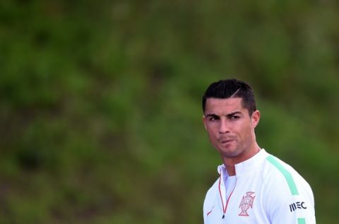 Portugal's forward Cristiano Ronaldo arrives to take part in a training session at the Braga Municipal  stadium in Braga on October 7, 2015, on the eve of the EURO 2016 Group I Portugal vs Denmark.   AFP PHOTO/ FRANCISCO LEONG        (Photo credit should read FRANCISCO LEONG/AFP/Getty Images)