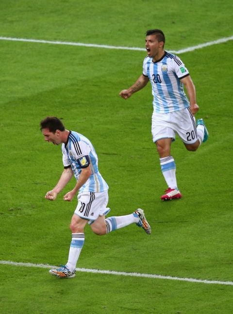 RIO DE JANEIRO, BRAZIL - JUNE 15:  Lionel Messi of Argentina (L) celebrates after scoring his team's second goal with teammate Sergio Aguero during the 2014 FIFA World Cup Brazil Group F match between Argentina and Bosnia-Herzegovina at Maracana on June 15, 2014 in Rio de Janeiro, Brazil.  (Photo by Clive Rose/Getty Images)