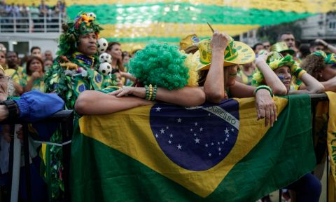 Brazil soccer fans react as they watch a live broadcast of the Russia World Cup quarterfinal match between their team and Belgium in Rio de Janeiro, Brazil, Friday, July 6, 2018. (AP Photo/Leo Correa)
